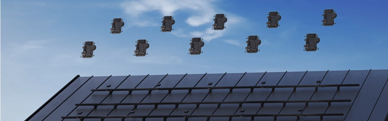 An image showing and array of Enphase microinverters hovering above a roof illustrating how they are allocated across an array of solar panels
