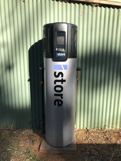 Image of an iStore 180L Solar Hot Water heater installed against a corrugated iron wall